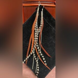Feather earrings.